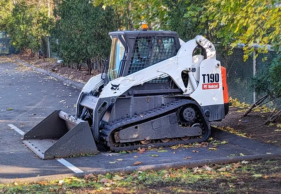 Bobcat T190 compact track loader parked with its bucket lowered.