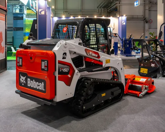 Bobcat T450 compact track loader with a forestry mulcher at Agritechnica 2023.
